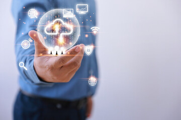 Technology business transformation concept. Businessman holding virtual cloud computing to transfer database. information upload, download application.