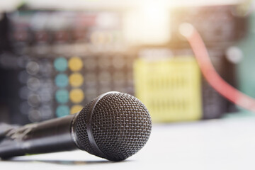black microphone with blur amplifier background