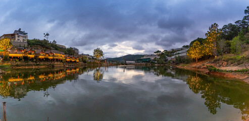 Fototapeta premium An Son Ho lake in sunset, Da Lat, Viet Nam. Beautiful landscape with clouds and misty. Panorama
