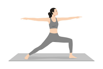 Warrior Pose II. Beautiful girl practice Virabhadrasana I. Young attractive woman practicing yoga exercise. working out, black wearing sportswear, grey pants and top, indoor full length, calmness