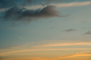 Beautiful view of sky with clouds at sunrise. Partly cloudy. Colorful sunset. Natural sky background texture, beautiful color.