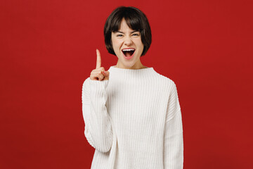 Young insighted smart proactive fun woman 20s wear white knitted sweater holding index finger up...