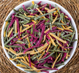 Vegetable noodles in bowl,wooden background