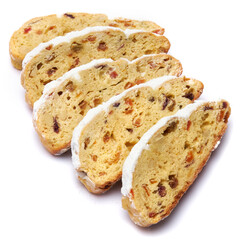 Sliced Traditional Christmas stollen cake with marzipan and dried fruit isolated on white background
