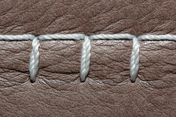 nylon thread stitches natural leather with a decorative seam