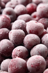 Frozen red sour cherry. Close up. Vertical. Concept eco organic food. Shock Freeze. Summer refreshing background or pattern. Preserve vitamins in berries.