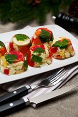 Portion of delicious chicken aspic on a plate isolated on concrete table