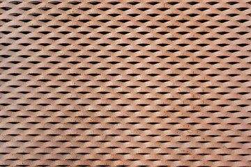 Fondo y textura de rejilla metálica oxidada en una pared