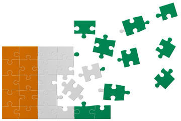 Broken puzzle- game background in colors of national flag. Ivory Coast