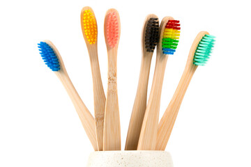 Close-Up Of Toothbrushes In Container Against White Background