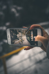 female hand and smartphone, photo on smartphone