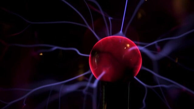 Plasma ball with energy rays on dark background, Physic model of plasma sphere