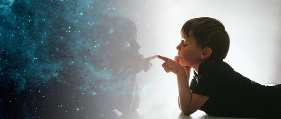 the child looks out the window and dreams that he is in space