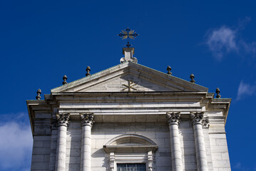 Close-up of front facade with beautiful ornaments of Cathedral named St. Ursen at the old town of Solothurn on a sunny winter day. Photo taken February 7th, 2022, Zurich, Switzerland.