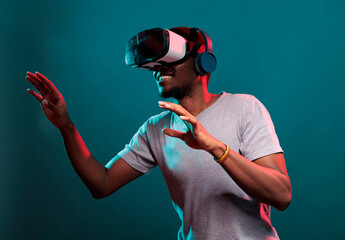 Smiling model playing virtual game on interactive vr goggles, having fun with modern 3d technology. Person using futuristic device with visual simulation and tech innovation, leisure activity.