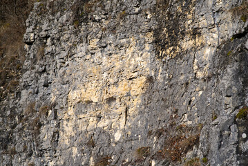 Close-up of chalk rock on a sunny winter day near the little medieval town St-Ursanne. Photo taken February 7th, 2022, Saint-Ursanne, Switzerland.