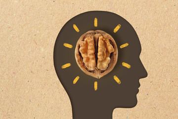 Man head silhouette with walnut - Walnuts are good for brain - 487737460