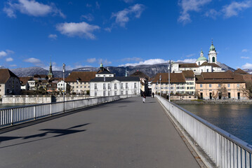 Cityscape of City Solothurn seen from the Kreuzacker Bridge with square in the foreground on a sunny winter day. Photo taken February 7th, 2022, Solothurn, Switzerland.