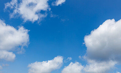 Naklejka na ściany i meble Blue sky with fluffy clouds 