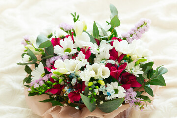 .Bouquet of spring flowers on a light background. Postcard. Place for text. March 8. Valentine's Day.