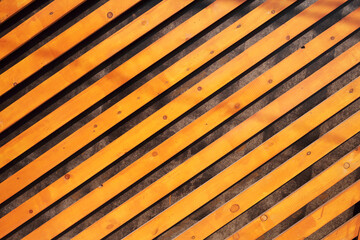 Decorative background of orange wooden slats arranged diagonally