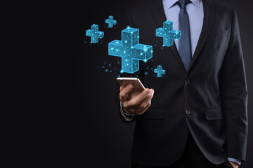 Businessman hand holding 3D plus low polygonal icon.Plus sign virtual means to offer positive thing like benefits, personal development, social network Profit,health insurance, growth concepts.