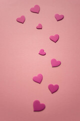 Lovely magenta pink hearts on pink paper table