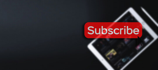 Subscription service. Online video red subscribe button. Internet service on laptop digital tablet blured banner background. Streaming video. Communication network.