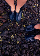 feet in a puddle wit stone