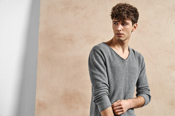 Portrait of sexy young man in gray sweater - 487746465