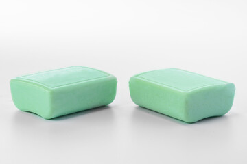 Green soap bars isolated on white background.