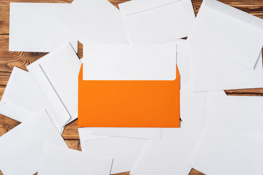 Stack Of Envelopes On Working Desk Top View. Business Mail