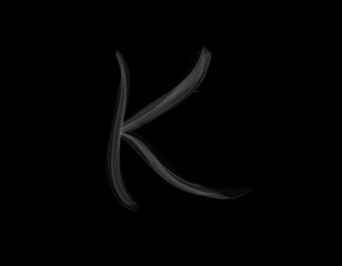 realistic K alphabet shape of smoke spreading on dark background