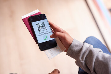 Covid19app, tickets and passport held by a man travelling