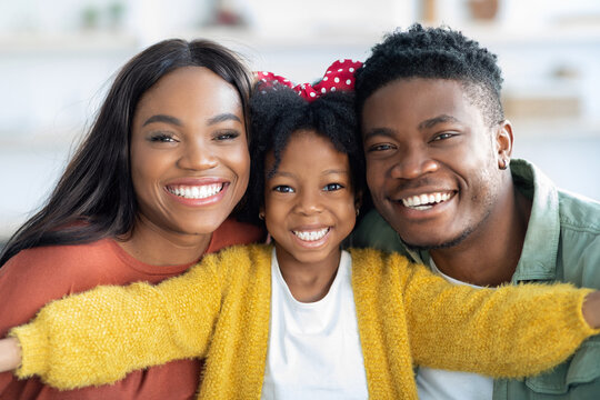 Family Selfie. Cute Little Black Girl Taking Selfie With Parents At Home