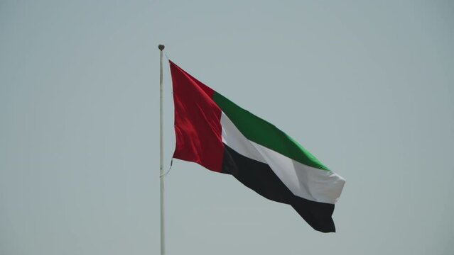 United Arab Emirates Flag on Quick Response Flagstaff. Quick response Flagpole in Dubai. The flag flutters in the wind
