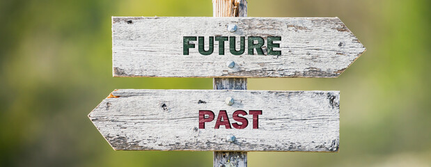 opposite signs on wooden signpost with the text quote future past engraved. Web banner format. - obrazy, fototapety, plakaty