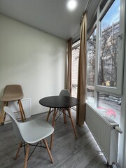 round table and chairs near the window