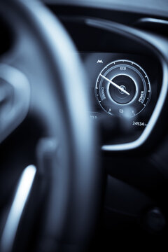 Digital dashboard of a new car, showing power and charge