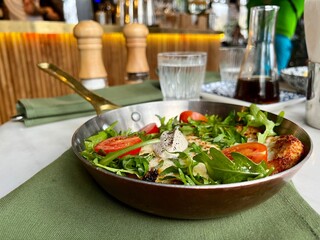 schnitzel with vegetables in a pan