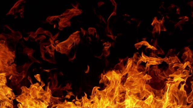 Super slow motion of fire blast isolated on black background. Filmed on high speed cinema camera, 1000 fps. Speed ramp effect.