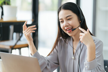 Freelance business women using tablet working call video conference with customer in workplace at...