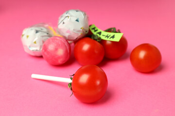 Concept of April Fool's Day on pink background