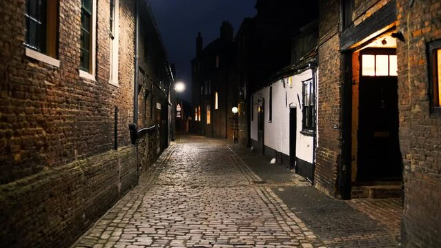 Night walk along the cobbled streets of King's Lynn, a port and market town in Norfolk, England, UK
