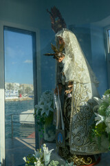 The virgin of the seas statue on the port at Marbella, Spain