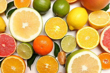 Citrus fruits with leaves on white background