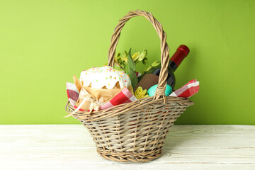 Concept of tasty Easter food on white wooden table