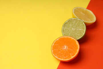Concept of tasty food with citrus fruits on two tone background