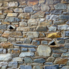 Multicolor polygonal masonry with two triangular technical openings in the region of the Principality of Andorra