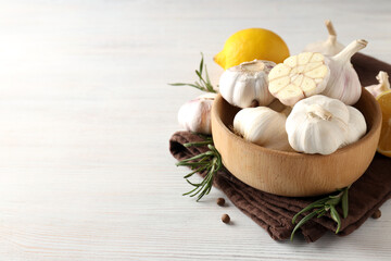 Ingredients for cooking garlic sauce on white wooden background